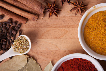 Frame composition of spices on wood,anise,cinnamon,laurel