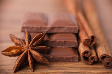 Closeup of cinnamon sticks and chocolate