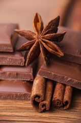 Closeup of cinnamon sticks and chocolate