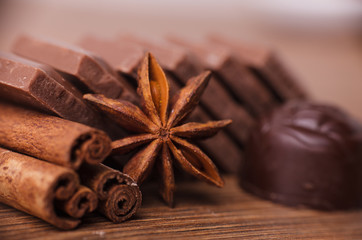 Closeup of cinnamon sticks and chocolate