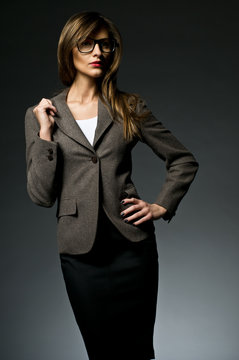 sexy elegant woman wearing suit and glasses