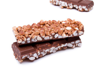 close up of chocolate with puffed rice bar on white background