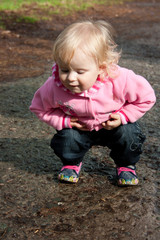 little girl playing in the street