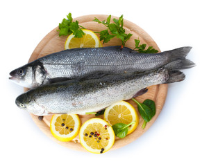 Fresh fishes with lemon, parsley and spice