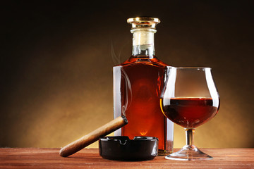 bottle and glass of brandy and cigar
