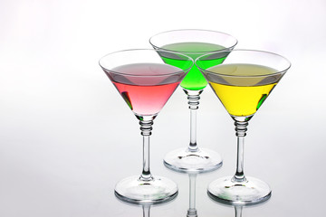 alcoholic cocktails on table isolated on white