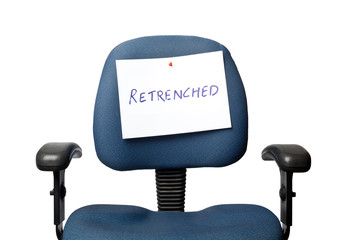 Office chair with a RETRENCHED sign isolated on white