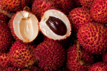 Halved lychee amid a pile of lychees