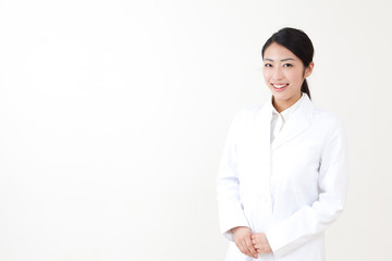 a portrait of asian woman wearing lab coat