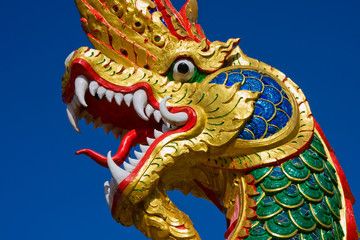 Fototapeta na wymiar Dragon statue at a temple in Thailand