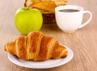 Classical breakfast. Coffee and croissant