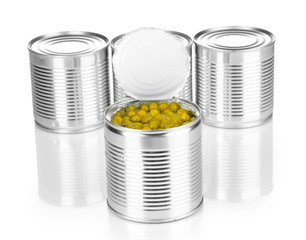 Open tin can of peas and closed cans isolated on white