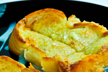 Toasted bread and butter, topped with sweetened condensed milk.