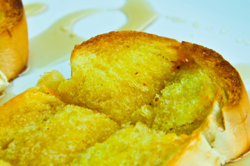 Toasted bread and butter, topped with sweetened condensed milk.