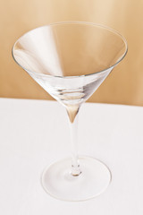 Martini glass in front of a beige background