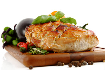Glazed Roast Pork with vegetables isolated on white background.