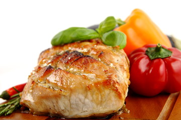 Glazed Roast Pork with vegetables isolated on white background.