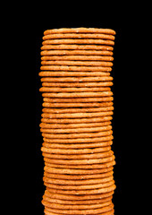 The high pile of crackers isolated on a black background
