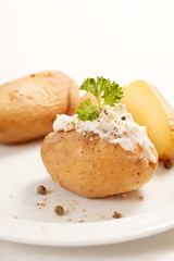 Baked potato filled with soft cheese