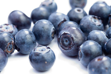 Fresh organic blueberries on white