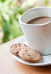 coffee cup with cookie .