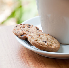 coffee cup with cookie .