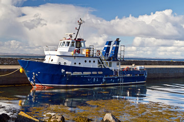 Small tourist ferry in Irish harbor