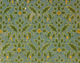 Green Thai floral pattern on temple wall