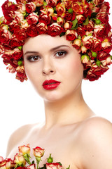 Fototapeta premium Beautiful girl with hairstyle of rose flowers