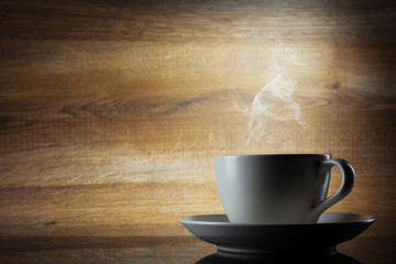 Coffee cup on wooden background