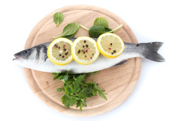 Fresh fish with lemon, parsley and pepper