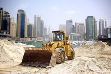 Naklejka premium Construction tractor in Dubai, United Arab Emirates .