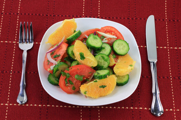Served in dish fruits and vegetables salad.