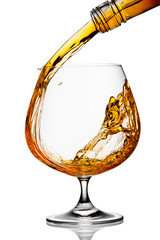 The glass with splashes brandy