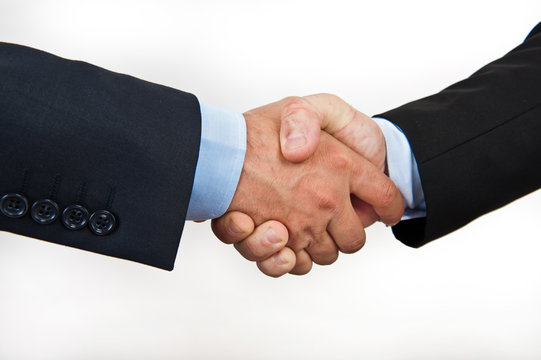 Hand shake between a businessmans  isolated on white