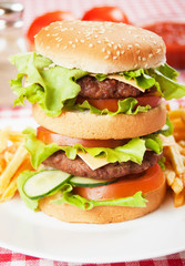 Double hamburger with cheese, lettuce and tomato