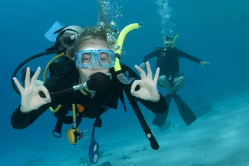 Poster man and woman scuba dive togeather © JonMilnes