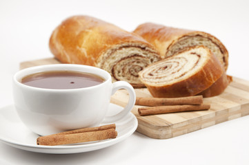 Tea and home sweet rolls with cinnamon