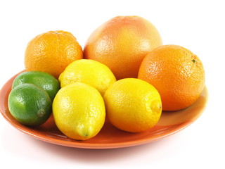 Tropical fruits on a plate, isolated