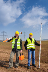 Geodesist two man equipment on construction site