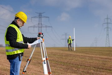 Geodesist measure land on construction site