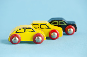 three wooden and old car toys