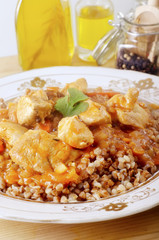 Buckwheat cereal with fried onions and carrots