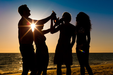 People having party at beach with drinks