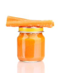 Jar of baby puree with carrot isolated on white