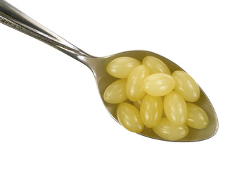 Aloe vera capsules in spoon