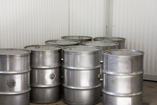 Industrial steel drums in a warehouse