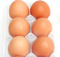 Fresh brown country eggs packaged in a dozen carton