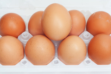 Fresh brown country eggs packaged in a dozen carton