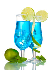 Blue cocktail in glasses with ice and sugar isolated on white